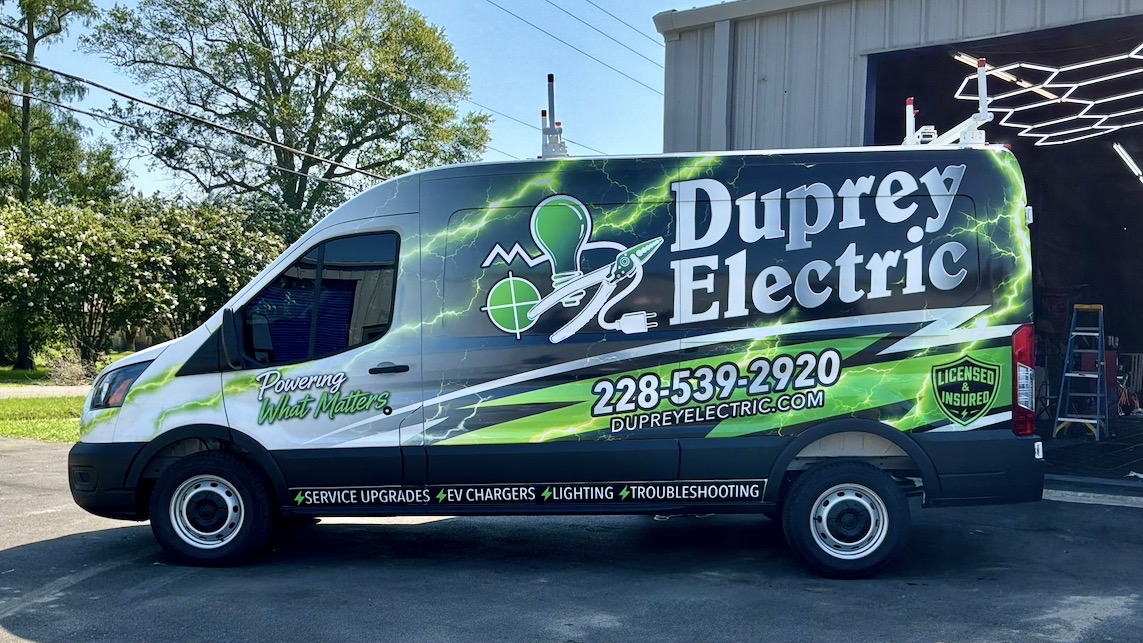 Full side view of the Duprey Electric van wrapped in green, black, and white